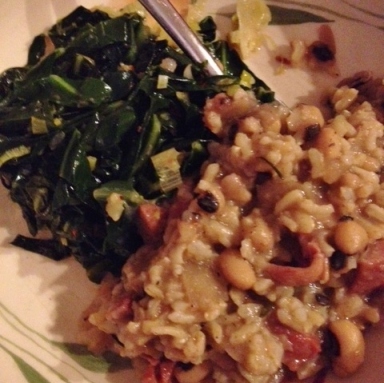 I made hoppin' john (black-eyed peas in smoked ham stock with rice) and greens for new year's day. It's supposed to bring you luck and prosperity throughout the year. It tasted far better than it looks. Trust  me on that one. 